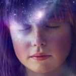 a young girl with eyes closed trying to manifest her desires